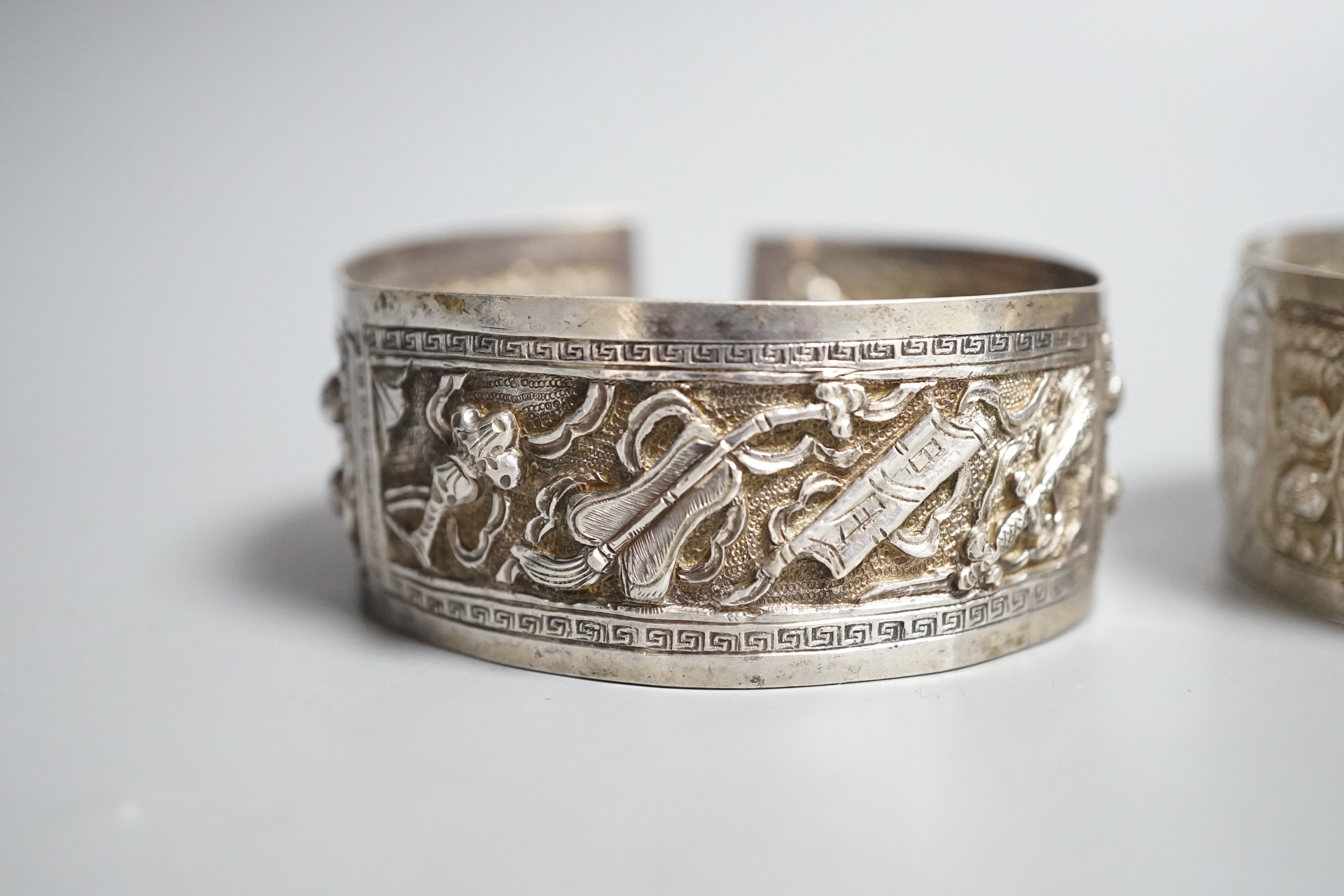 A pair of early 20th century Chinese white metal bangles
